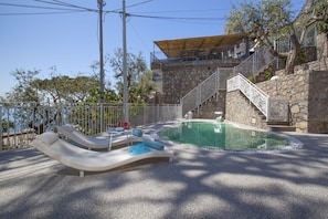 Balcony / Terrace / Patio, Building Exterior, Garden, Main Entrance, Pool, Spring, Summer