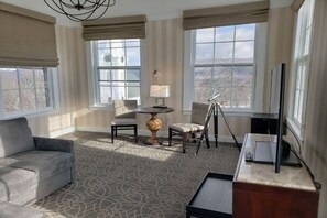 Step into a panoramic sanctuary bathed in sunlight, where spaciousness and modern design coalesce to create an idyllic retreat.