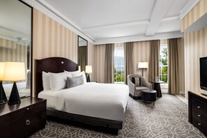 Delight in the timeless elegance of our spacious bedroom, offering a perfect blend of luxury and coziness.