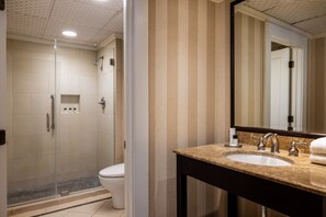 A pristine bathroom space that promises a revitalizing routine with its sleek design and modern comforts.
