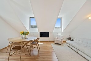 Our loft’s dining area: where every meal comes with a side of sunshine.