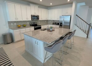 Gather 'Round the Table: Enjoy delicious meals in this spacious kitchen