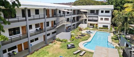 Paradizio 304 - A tranquil oasis just steps from the beach! Enjoy amenities like a large pool, lounge areas, BBQ pavilion plus gated entry and parking!