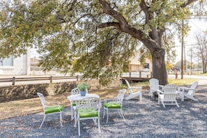 Shared outdoor seating area with wood-burning fire pit.
