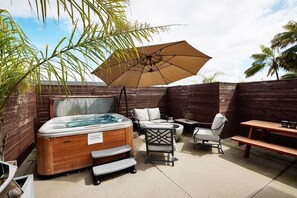 Soak up the sun, Lounge in the hot tub and relax outdoors in the perfect outdoor Oasis right next tot the beach! 