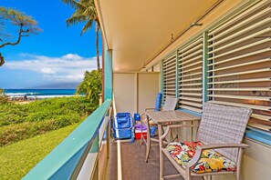 The lanai with beach chairs & umbrella, cooler, boogie board & noodle floater. 