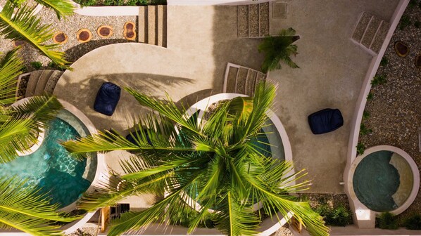 Two outdoor pools with plush sunbeds, including pool and beach towels provided for your convenience.