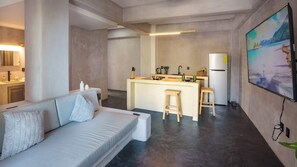 Living room with TVand Kitchen
