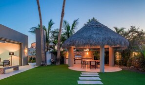 Charming palapa with a BBQ grill and outdoor dining space, perfect for al fresco meals.