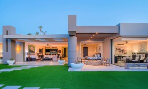 Elegant villa facade with an open-concept design, blending indoor and outdoor living.