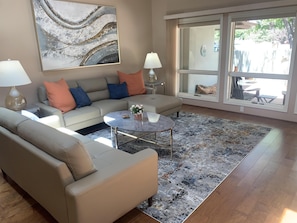 Comfortable living room with views of the front patio and Castle Rock