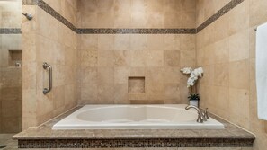 Large raised tub in the master bedroom.