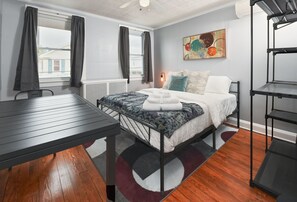 Queen bed, Black-out shades & nightstand with charging station.