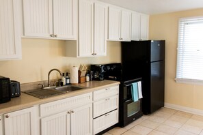 Kitchen has most of your cooking needs. Including coffee maker, toaster, microwave, oven, and refrigerator,