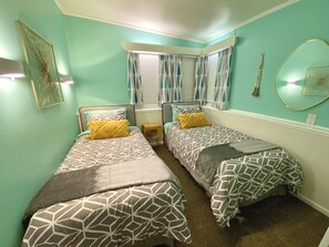 This minty room features two XL Twin Beds.
