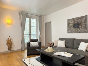 Enjoy movie nights in the cozy living room with a flat-screen TV