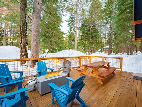 Deck also offers a picnic table and firepit.