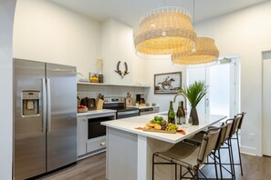 Fully equipped kitchen with a full suite of stainless steel appliances.