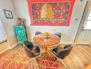 Dine at the cool vintage table set on one of my rugs from Morocco that I also brought back by hand. I have a habit of finding large and heavy items abroad and flying them home with me!