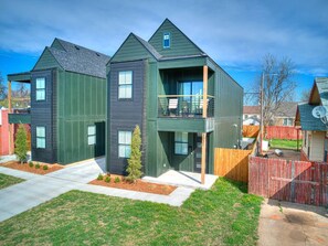 Welcome to your urban oasis in Oklahoma City! Our modern two-story townhouse, adorned in serene dark green, invites you to unwind and create lasting memories. Picture yourself sipping morning coffee on the spacious balcony, surrounded 