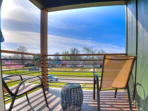 “Step onto our tranquil balcony oasis! Breathe in the fresh air, sip your morning coffee, and soak in the serene view. Whether you’re unwinding with a book or simply enjoying the quietude, this is your private escape. Welcome to relaxation!” 🌟🌿