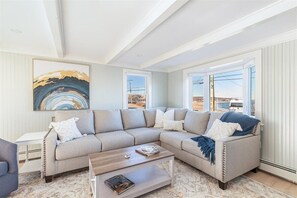 Living room with ocean and beach views