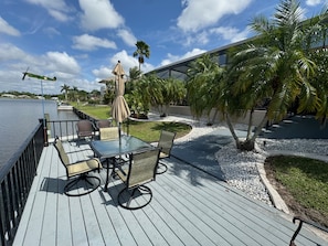Boat Dock with seating, table and umbrella
