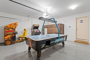 The garage has been converted to a game room for entertaining kids of all ages!