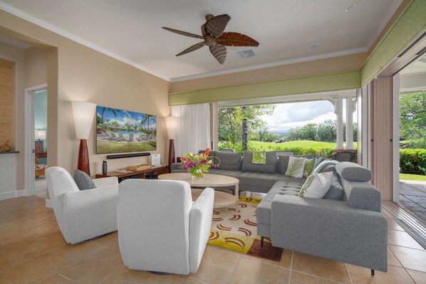 The family room with large sliding doors that open up to the lanai and back yard.