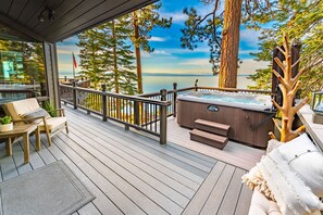 There’s a full size BBQ & large outdoor dining table w/ umbrellas on main deck