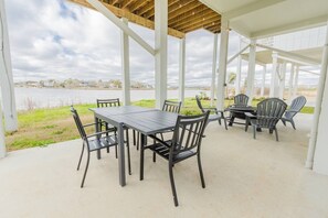 Down Stairs Entertaining Space with Table chairs, bar b q pit and fire pit! 