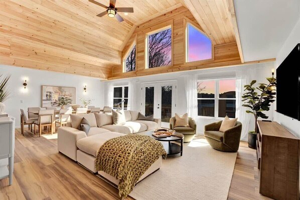 Great room with vaulted pine ceilings, meticulously designed living and dining area.  Enjoy unobstructed lakeviews from the comforts of the great room.
