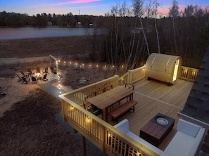 Enjoy the ambiance as you overlook the lake from the deck or sauna.  Walk down to the firepit from the deck stairs.