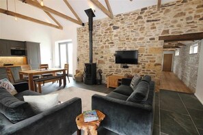 Open plan living - french doors to courtyard patio