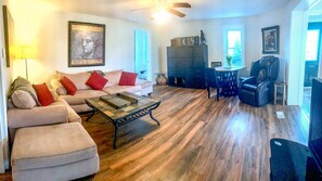 Comfortable furniture, large screen smart TV.