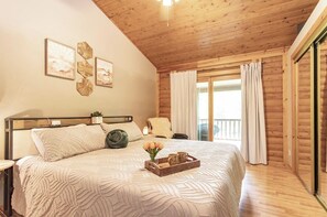Master Bedroom with King bed and cuddle dud duvet.  Opens to covered deck