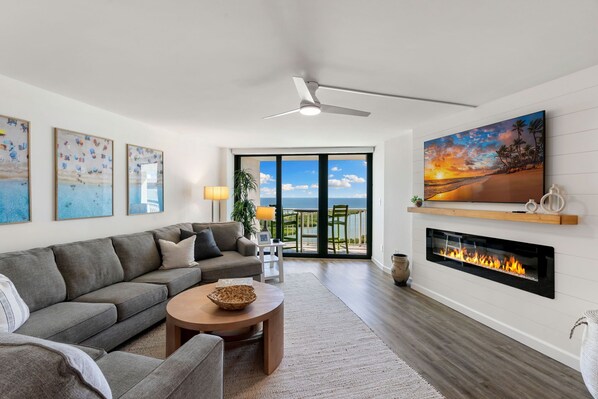 Spacious living area, sofa bed sectional, Samsung Smart TV, balcony, electric FP