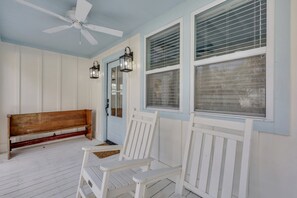Welcome to your slice of paradise! Take a seat in our inviting rocking chairs on the front porch, where gentle sea breezes and the soothing hum of a fan create the perfect ambiance for relaxation. Let the sounds of the ocean and the rhythm of the rocking chairs carry you to pure beachfront bliss. 🌊🏝️ #FrontPorchParadise #BeachLifeRelaxation #RockingChairMagic #TybeeIsland #Lu...