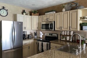 Renovated Kitchen with Granite Counters and Stainless Appliances