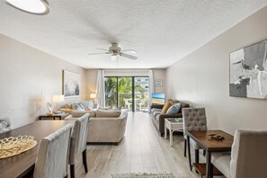 A bright and spacious living room designed for relaxation, where natural light enhances the cozy yet modern feel.