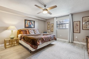 A peaceful master bedroom featuring soft lighting, stylish decor, and a plush bed for the perfect night's sleep.