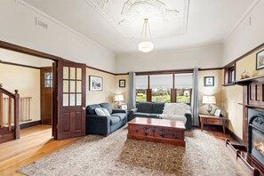 Spacious living area with comfy couches & Smart TV