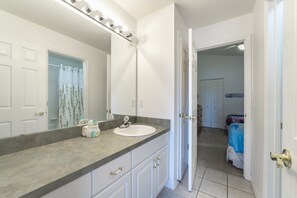 Jack n Jill Bathroom with shower/ tub combo between bedrooms 3 and 4.