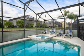 Pool and waterfall spa showing seating and view
