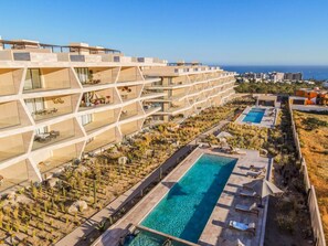 Dive into luxury at our communal pool – where relaxation meets panoramic views of paradise