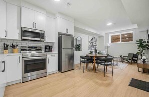 Cook up some nice meals in this clean and fresh kitchen!