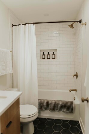 Indulge in a refreshing shower experience with our fully equipped bathroom, complete with complimentary body wash, shampoo, and conditioner for a luxurious cleanse from head to toe.