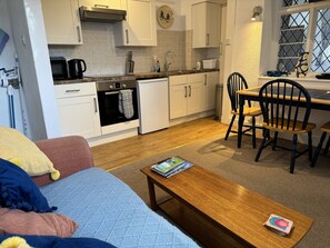 Kitchen with dining table and sofa