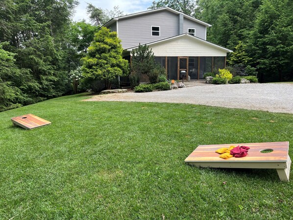 Renovated in 2024 with BEAUTIFUL landscaping, a big lawn, and cornhole!