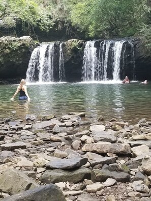 Sycamore Falls is directly below Fiery Gizzard Lodge.  You can see it, hear it!